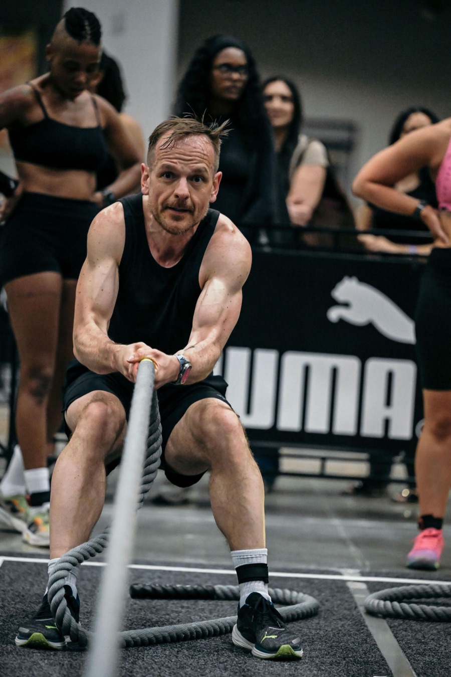 Joe Rideout pulling a rope at a fitness race